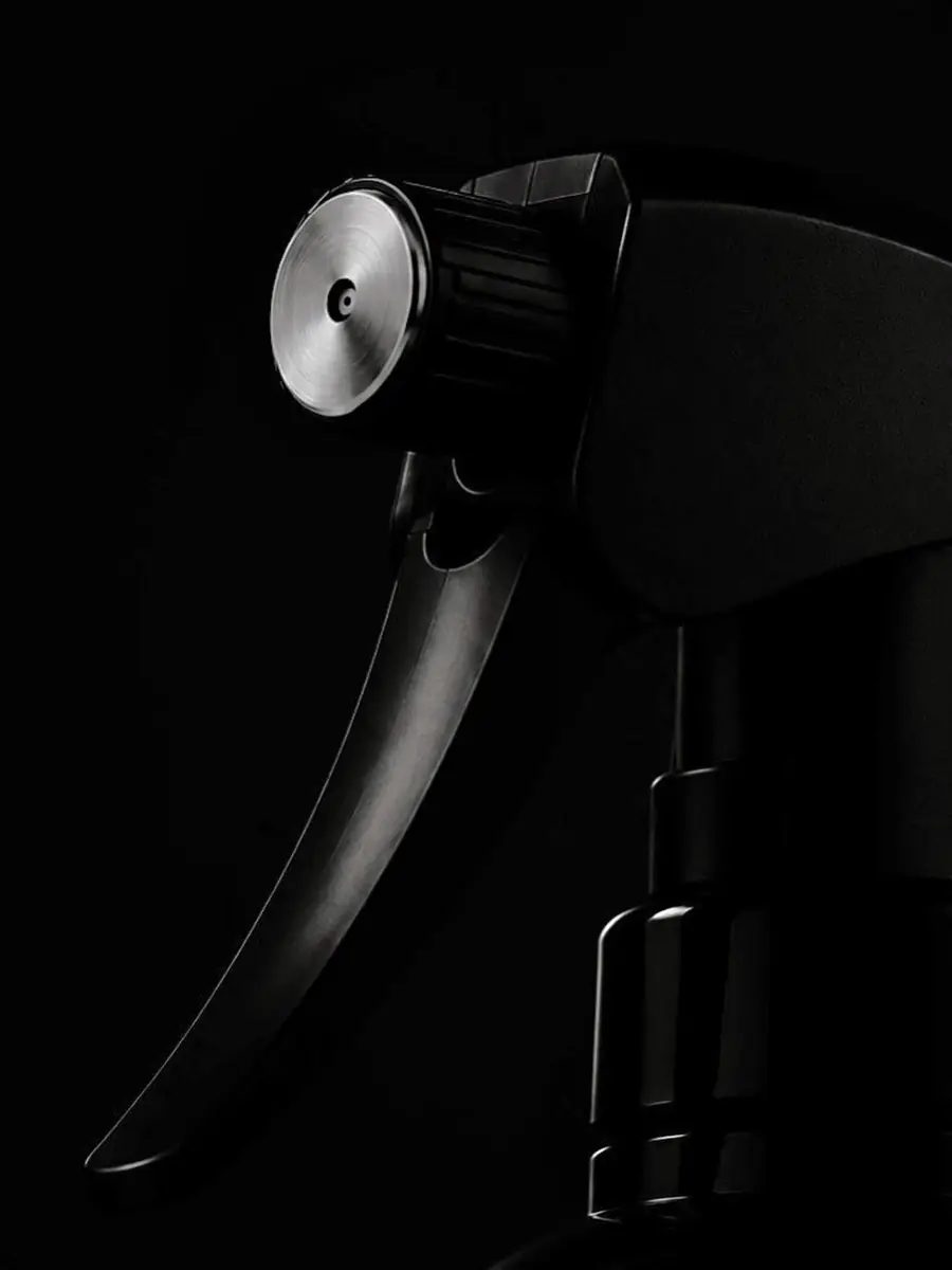 QUIET HOUR — black spray object study with metal nozzle and controlled shadow