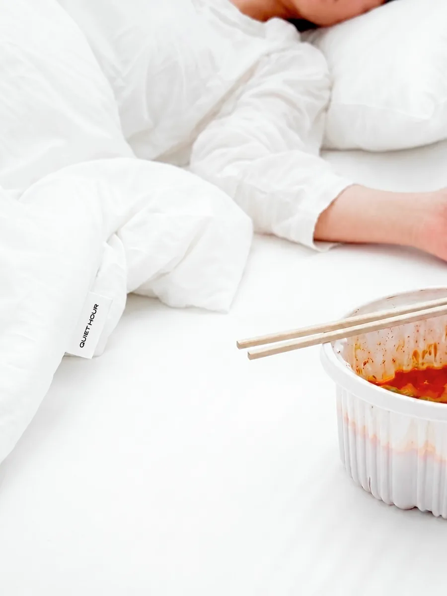 QUIET HOUR — editorial bedding and meal detail with soft white atmosphere